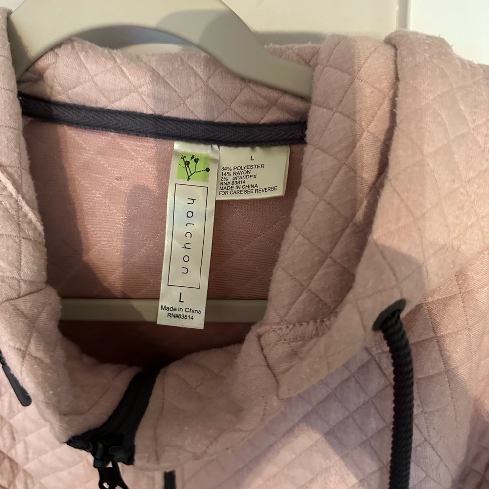 Pink quilted zip up hooded sweater light to medium weight covers backside